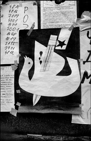 PRAGUE, Czechoslovakia—A poster in a window with a dove stabbed through the middle, August 1968. © Josef Koudelka / Magnum Photos