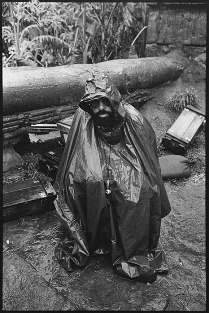 Director Francis Ford Coppola shelters himself from the driving rain that added to the troubles of an already beleaguered shoot for Apocalypse Now (1979). Mary Ellen Mark