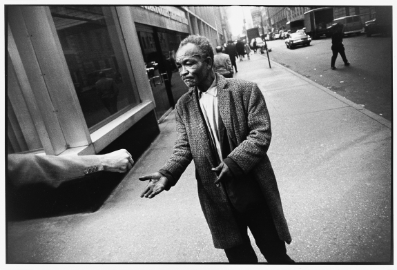 Street Beggar Reaching Out to Receive a Donation, Garry Winogrand, 1968 © The Estate of Garry Winogrand